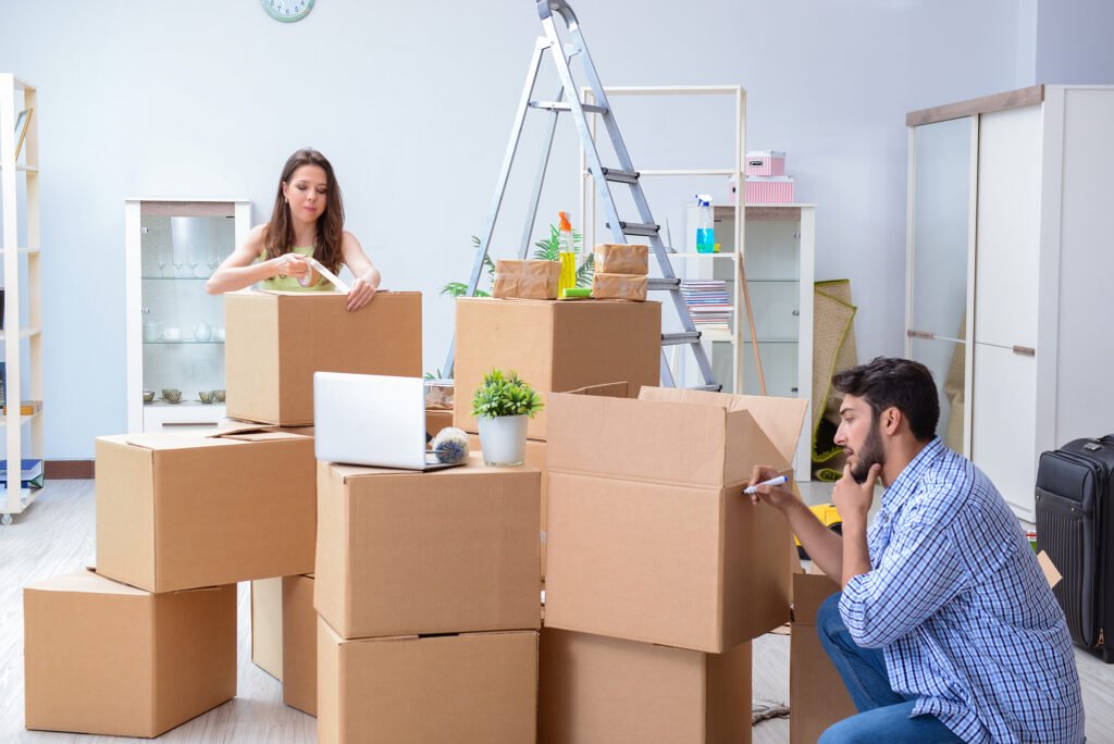 Experienced Moving and Packing Services Sacramento experts loading securely packed boxes into a moving truck.